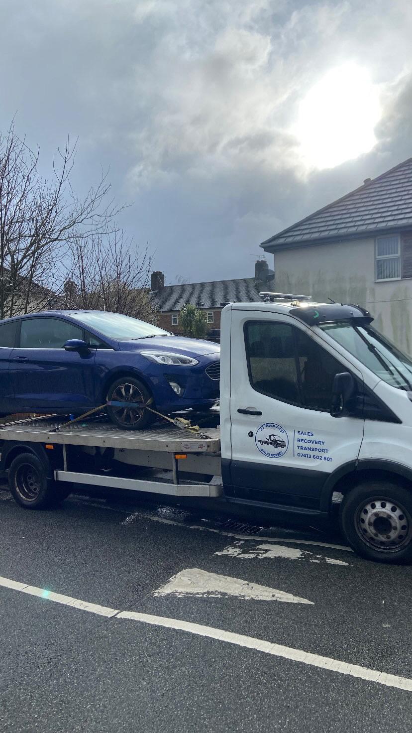 JJ Recovery 1 — Ford Fiesta loaded on the flatbed recovery truck